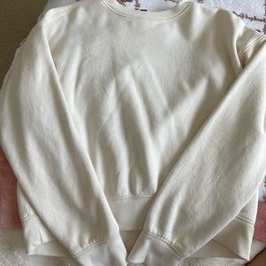 cream colored sweat shirt
